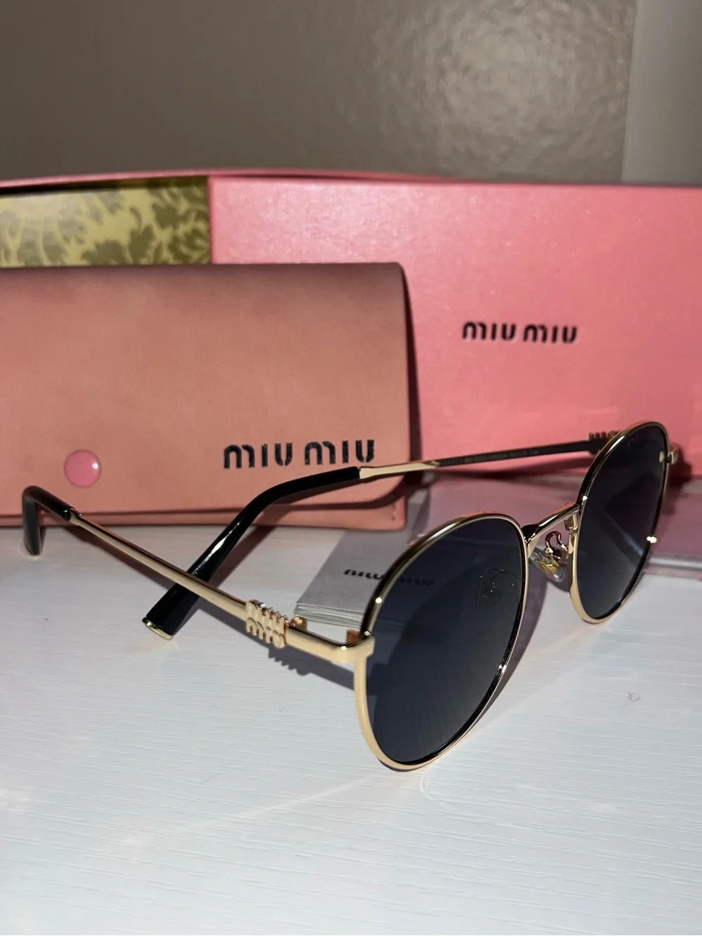 Miu Miu Gold Metal Round Sunglasses with Black Lenses